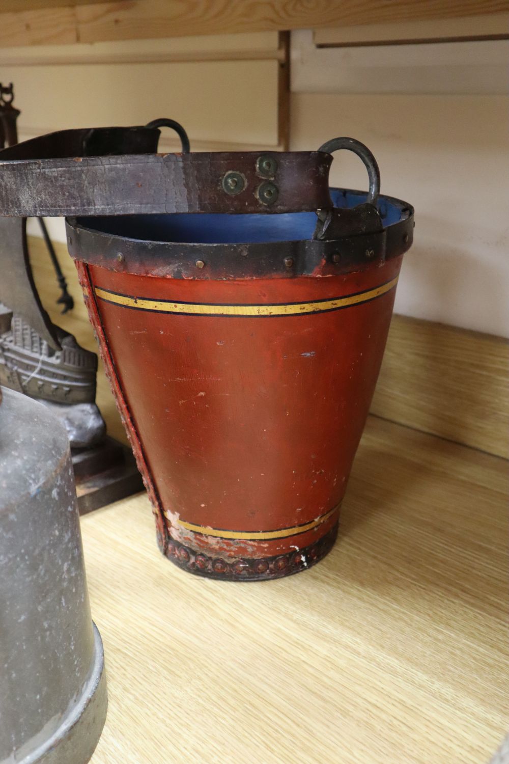 A Merryweather painted leather fire bucket, 11in. and an assortment of domestic utensils (13)